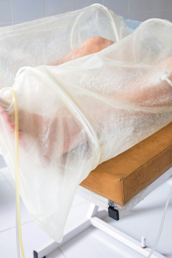 Ozone therapy treatment on legs of man
